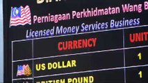 Malaysia currency slides 12 percent in three weeks