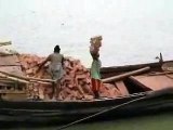 This brickies labourer from Bangladesh is carrying 22 bricks on his head !