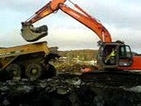 A Gps excavator Hitatchi loading Dumper