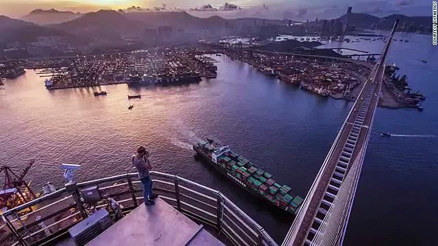 climbing tall buildings with bare hands