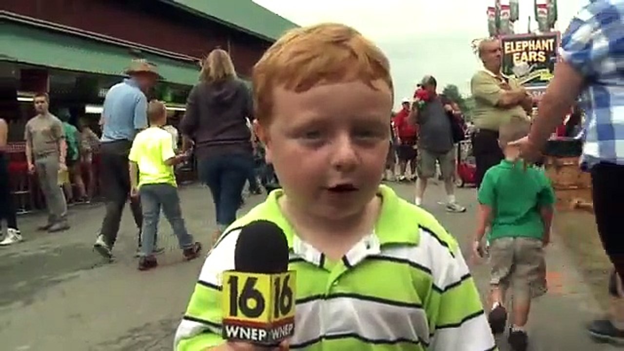 "Apparently" This Kid Is Awesome: Steals The Show During Interview At Amusement Park!
