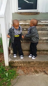 Twins little boys are so cute going down the stairs