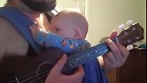 Little girl goes from crying to sleeping in two minutes listening to her father sing