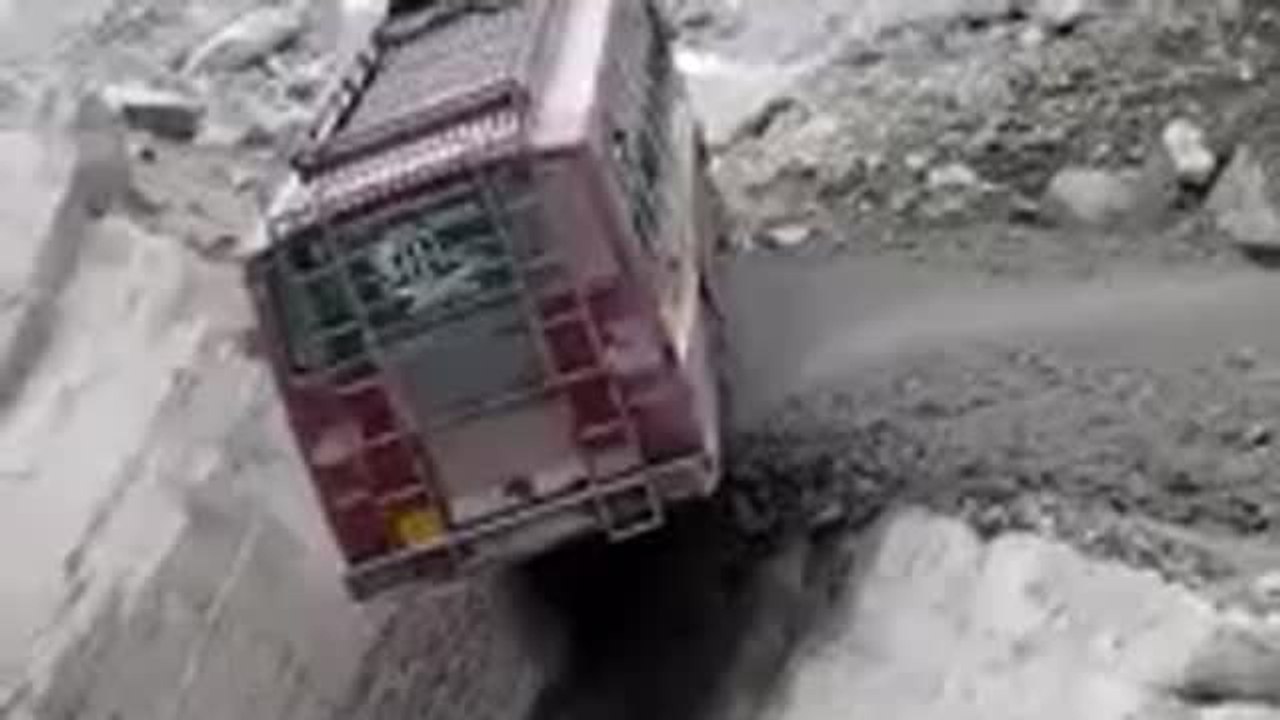 Landslide knocks bus off mountain road