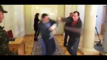 Moment Ukrainian politicians get into fistfight outside chamber