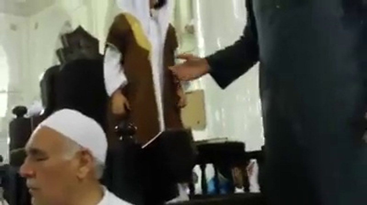 A small boy is preaching in Masjid Haram