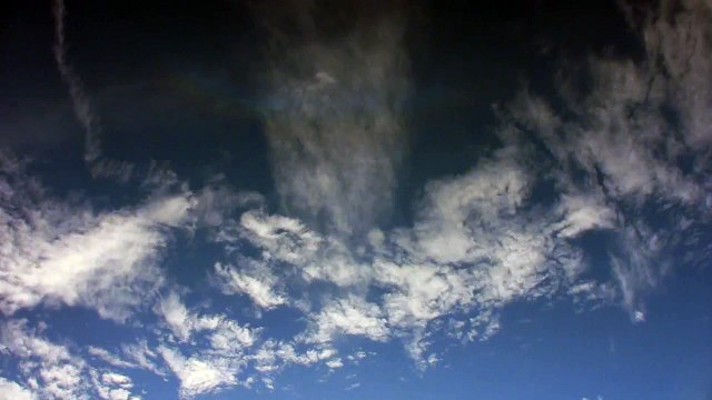 Time lapse clouds with rainbow 3 hours in 1 minute