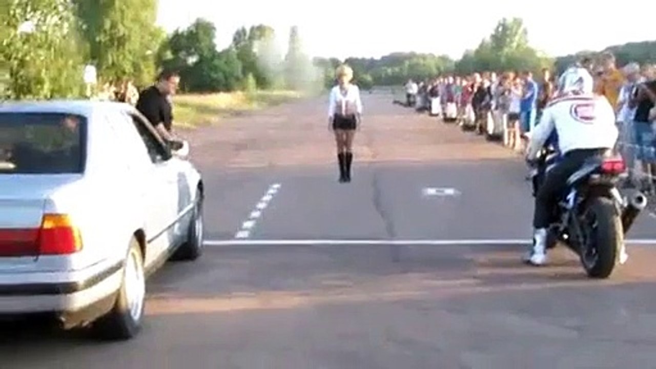 interesting race between car and motorcycle