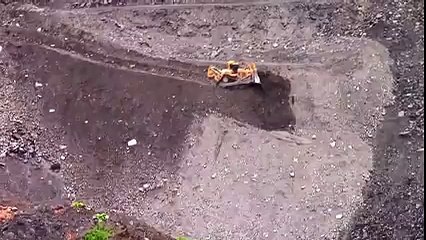 SIDE SLOPING – This driver has the most dangerous job in the world!
