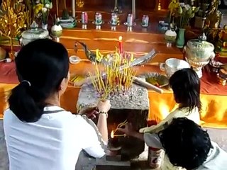 Praying to Buddha at Angkor Wat