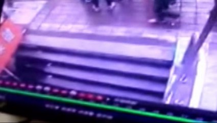 Four people fall into hole as it opens up in pavement