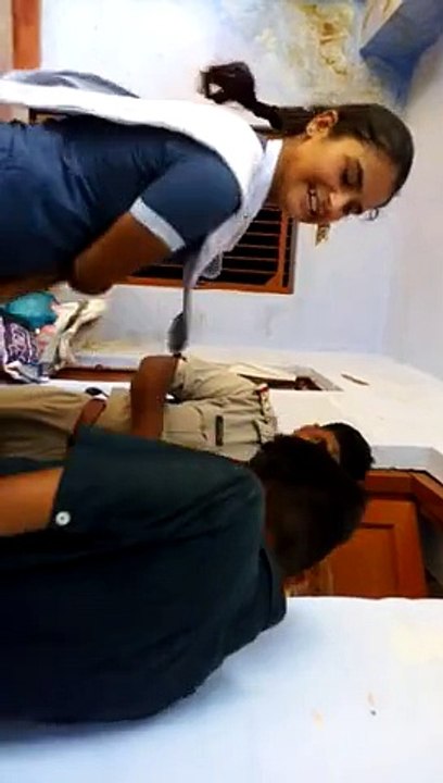 Girl beats boy inside a police station for calling bad names