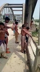 Watch young boys diving in a canal amazingly