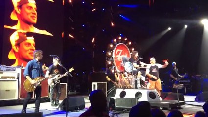 Dave Grohl shares beer onstage with man on his 50th