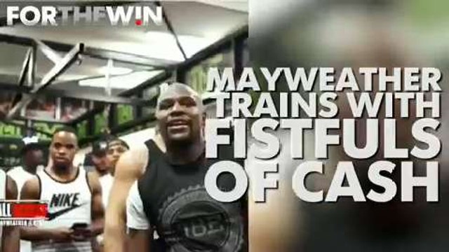 Floyd Mayweather trains with fistfuls of cash