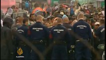Hungarian police fire tear gas at refugees following unrest