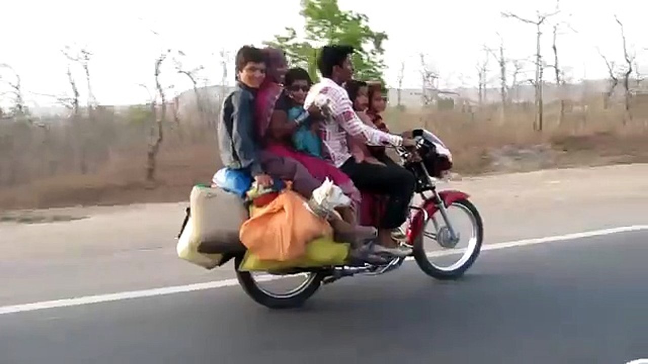 Family of 6 and their two pets get together on a motorbike