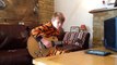 10-Year-Old Kid In Tiger Footie Pajamas Plays Guitar Like B.B. King