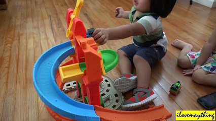 A 2 year old Boy playing some Thomas the Tank Engine & Friends Toys