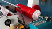 Laminated non woven sheet cutting and loop handle fixing machine