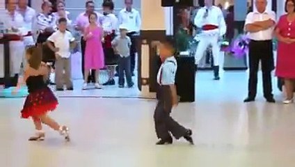 two kids are dancing awsome