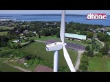 Drone pilot spots man sunbathing on top of wind turbine