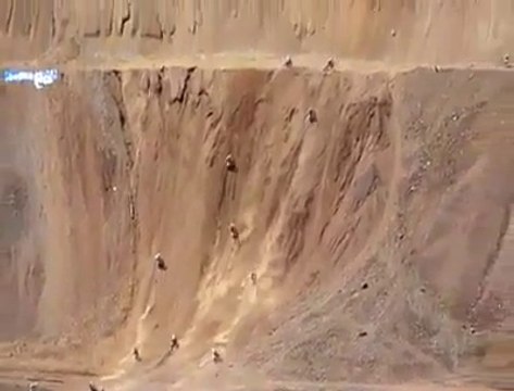 Biker climbing vertical cliff... Just Insane!
