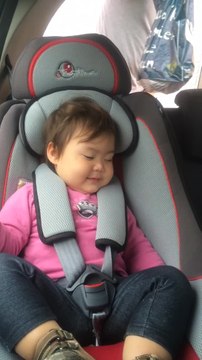 Baby fakes sleeping in order to stay in car