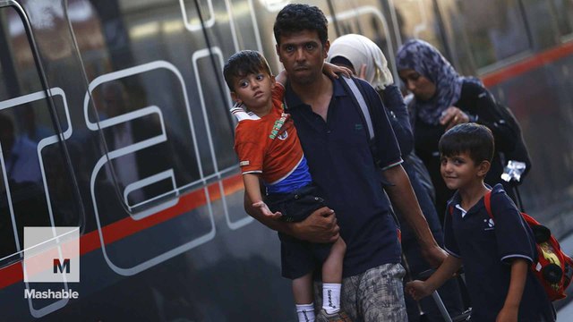 A tale of two train stations: Scenes from Europe as refugees seek shelter