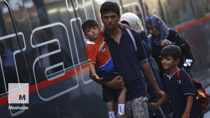 A tale of two train stations: Scenes from Europe as refugees seek shelter