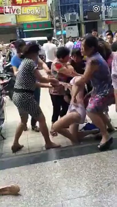 Woman being stripped in public