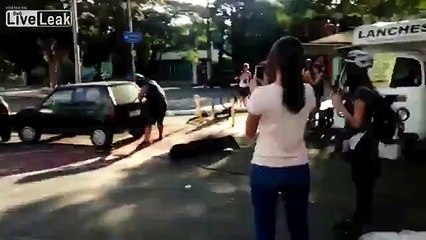 Strong man moves car