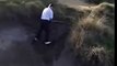 Man attempts difficult bunker shot, tumbles backwards in said bunker