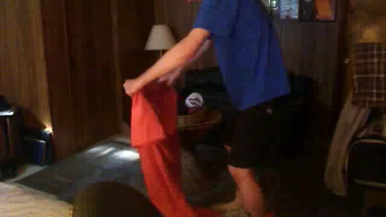 Man falls trying to put on a jumpsuit, gets yelled at by mom