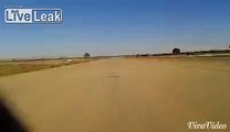 Absolute crazy flyby by a libyan MIG-23 over the head of a snackbaring  soldier