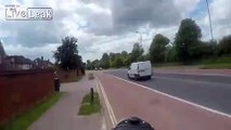 Instant Karma! Cyclists cuts off a car, then flips him off, turns around and crashes into the curb