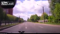 Biker takes a red light and t-bones a car with high speed