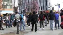 Plainclothes policeman interrupts an after school brawl in Downtown Brooklyn rather abruptly