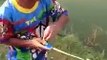 Boy catches fish with a toy fishing pole