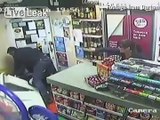 Shopkeeper defeats axe-weilding robber