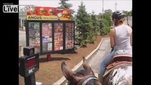 Girls On Horseback Order Burgers At McDonald's Drive-Thru