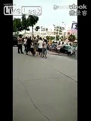 Woman stripped topless in public