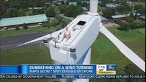 Drone catches man sunbathing on top of wind turbine Drone VIDEO man Sun Tanning