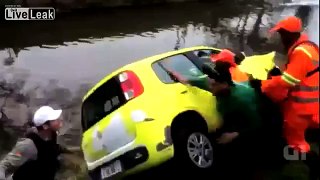 Street Sweepers tossing car into a canal.