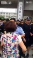 Woman tries to bite police officers in front of govt gate