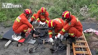 Trapped Old Man Rescued from Asphalt Pit By Firemen
