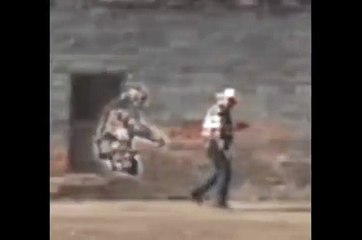 Bob Heironimus walking with Patty beside him