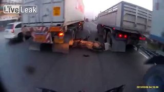 Scooter Rider Is Unbelievably Lucky To Be Alive After Falling Between 2 Trucks!