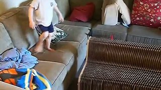 3 year old boy Moving a paper couch
