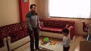 Kid playing with dad while in prayer